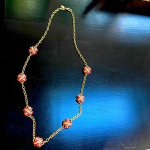 Tory Burch necklace gold chain with 7 T’s in red and gold